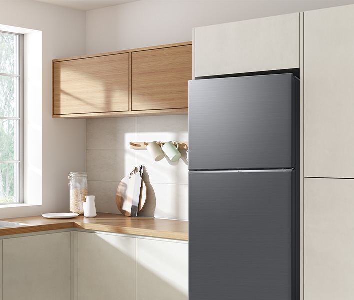 The sleek exterior of the fridge gives a clean look to the modern kitchen, with a flat finish.