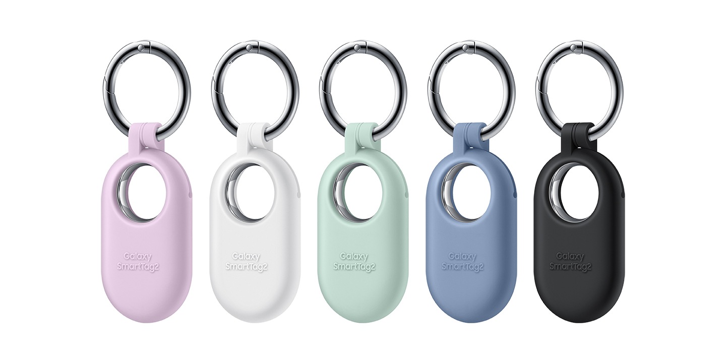 five galaxy smarttag2 devices are shown, each with a different silicone case colorway in the following order from left to right: lavender, white, mint, blue and black.