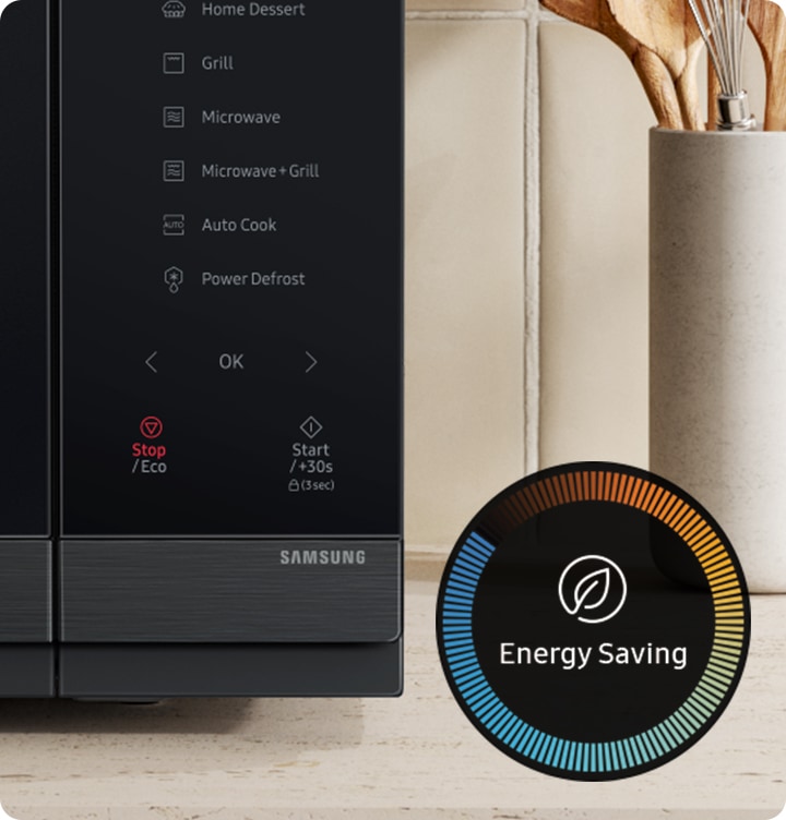 Shows the control panel of microwave. The icon for energy saving is displayed on the side.