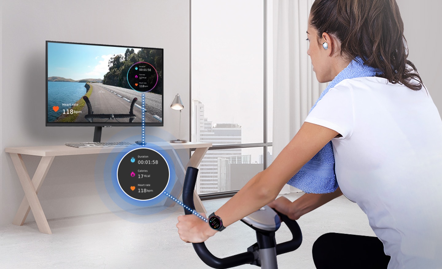 A woman is riding an indoor bicycle. She is wearing a Galaxy Watch and Buds, and her watch screen is overlaid on the monitor.