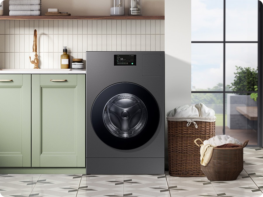 A Laundry Combo is installed in a modern utility room, next to a green sink with two full laundry baskets nearby.