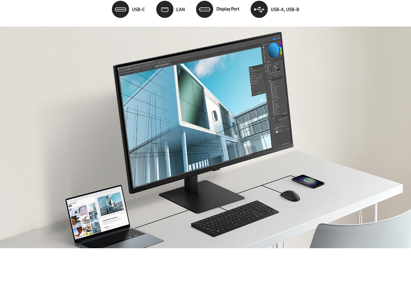 A laptop, monitor, keyboard, mouse and mobile phone are all connected on a desk by a wire. Above the monitor, there are 4 icons, which are USB-C, LAN, Display Port, USB-A and USB-B.
