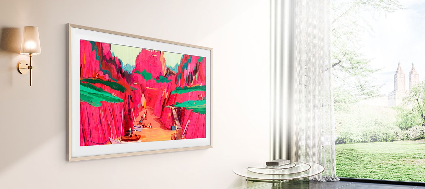 The Frame Pro on living room wall shows art with Wireless One Connect box placed on side table without wire connection to TV.