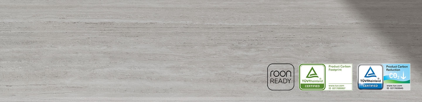 A soundbar, a subwoofer and two rear speakers. Roon Ready logo. TUV Rheinland® Certified Product Carbon Footprint www.tuv.com ID 0217009957 logo. TUV Rheinland® Certified Product Carbon Reduction CO2↓ www.tuv.com ID 0217009945 logo.