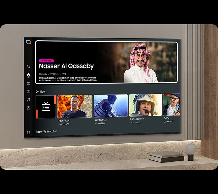 TV in a living room shows Samsung TV Plus home screen and the diverse TV channels available with it.