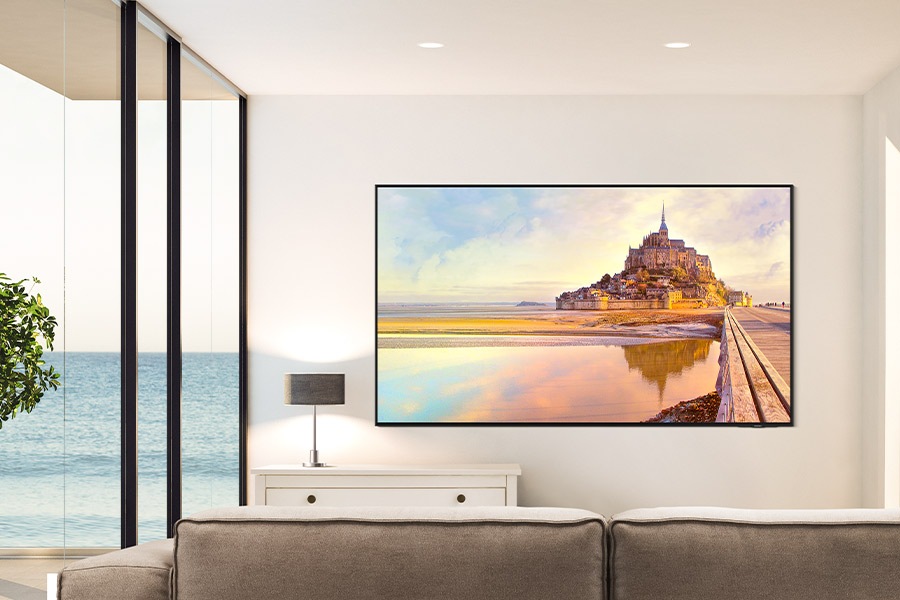 QN90D is wall-mounted in a clean white living room.