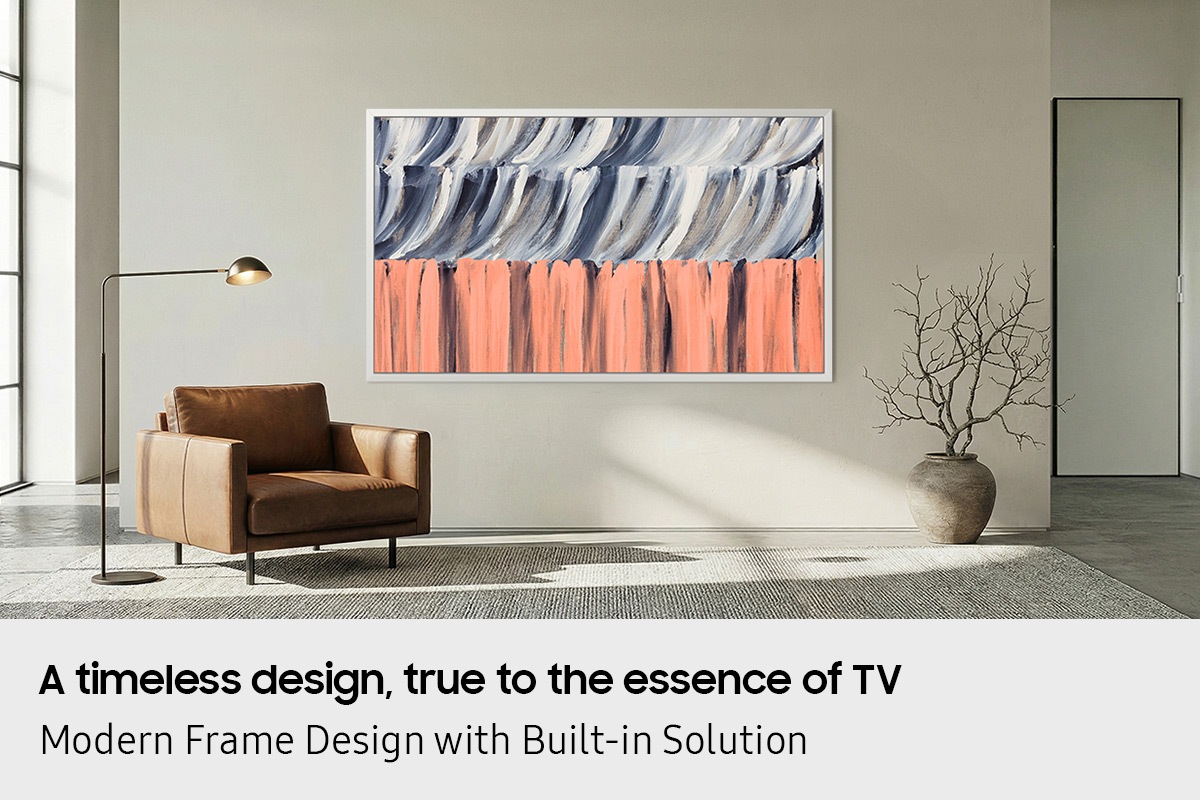 Minimalist living room with large window, leather armchair, and floor lamp, featuring The Frame TV mounted flush to the wall displaying abstract artwork, blending seamlessly like a framed painting.