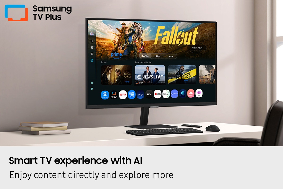 Smart TV experience with AI. Enjoy content directly and explore more. Monitor on desk displays Smart TV Apps page with various content and apps lined up. Samsung TV Plus logo.
