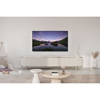 QN90D on a console in a stylish white living room.