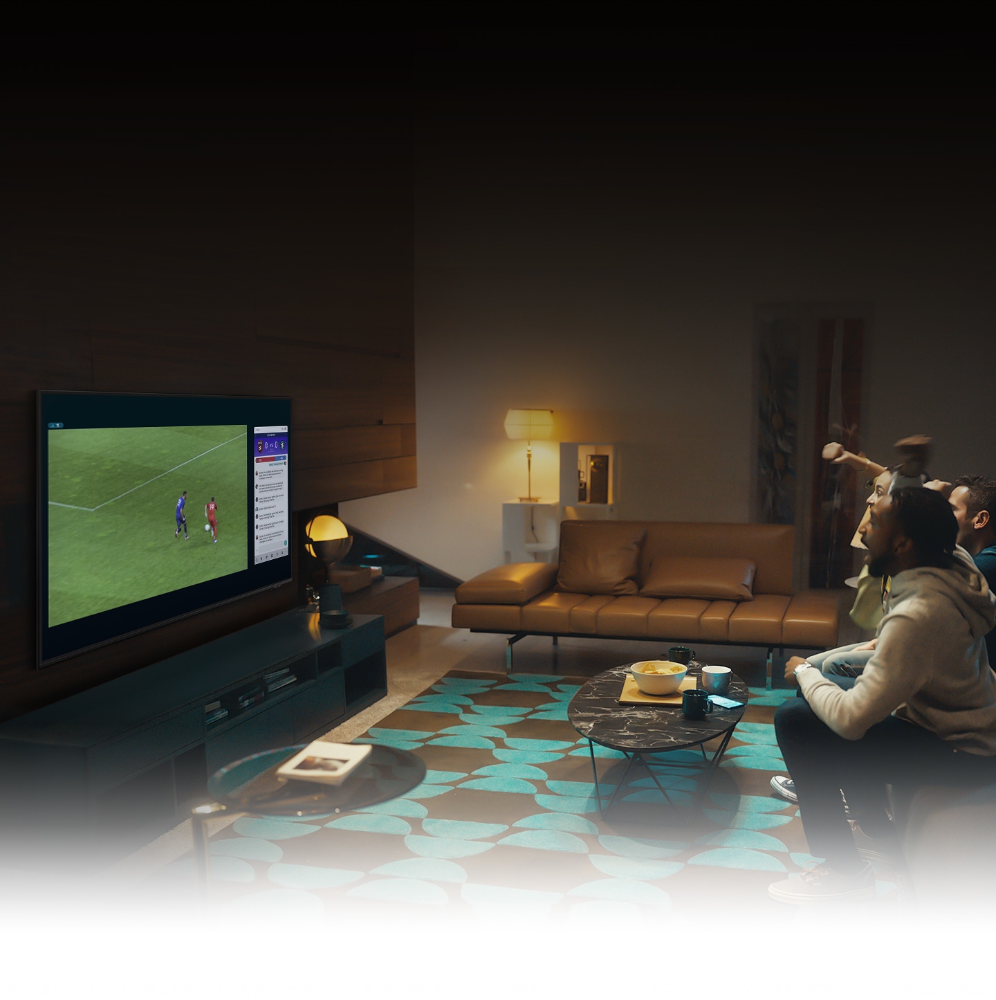 A group of people use QLED TV Multi view feature to enjoy a football match and view play-by-play information at the same time on the same screen.