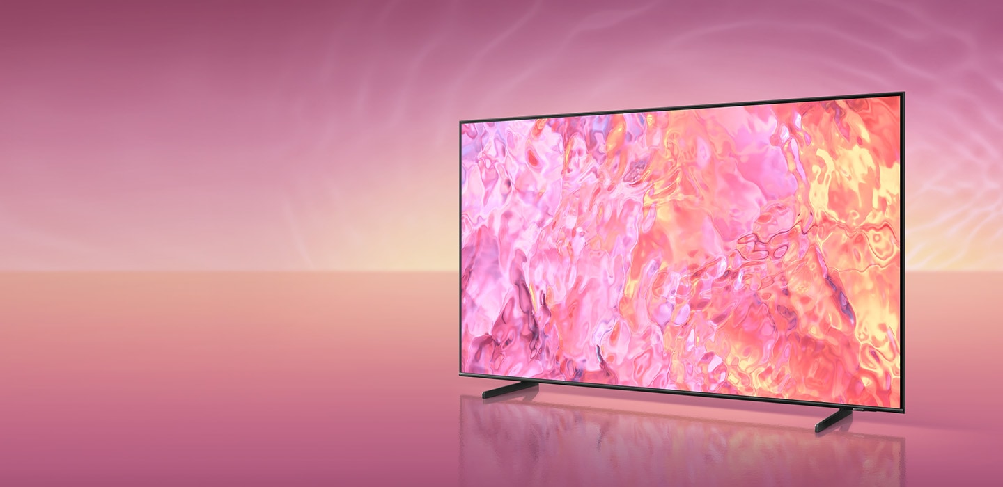 A QLED TV with a new simple stand is displaying pink graphic on its screen.