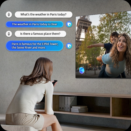 Woman in living room speaks to Bixby through the TV. Captions of the dialogue are shown. What’s the weather in Paris today? The weather in Paris today is clear. Is there a famous place there? Paris is famous for the Eiffel Tower, the Seine River and more.