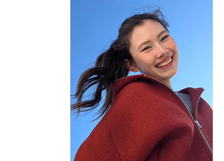 Portrait of a woman taken outdoors. Lighting is precise and subject's features are accurate.
