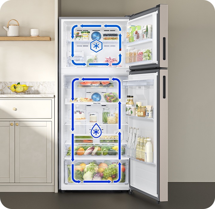 The door of the refrigerator is open. The arrows indicate that cold air is circulating in the top freezer and bottom fridge respectively.