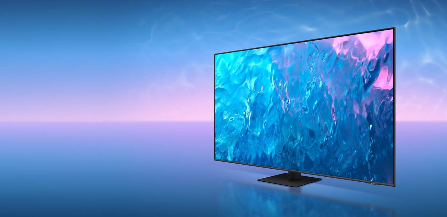 A QLED TV with a narrow neck plate is displaying blue graphic on its screen.