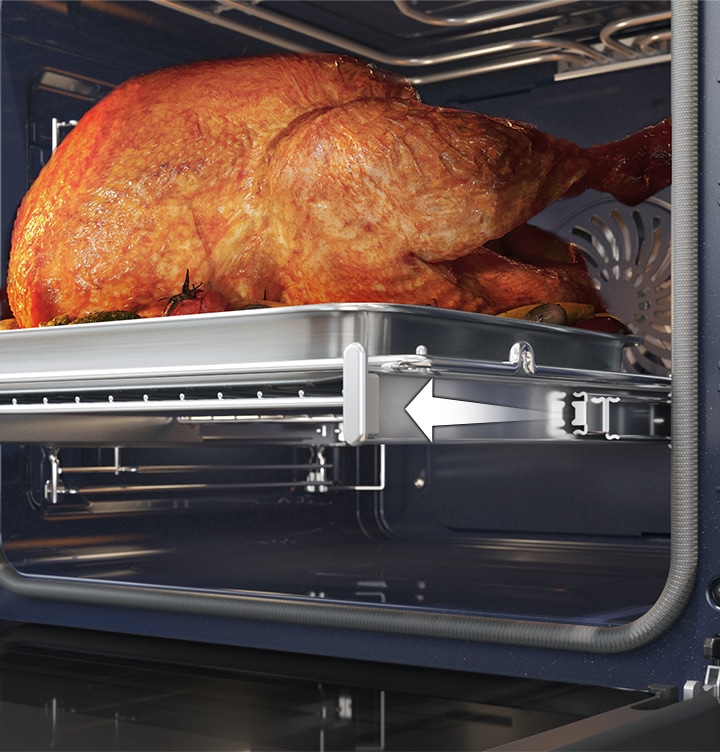 Shows a large roast turkey sliding out of the oven on the Telescopic Rail.