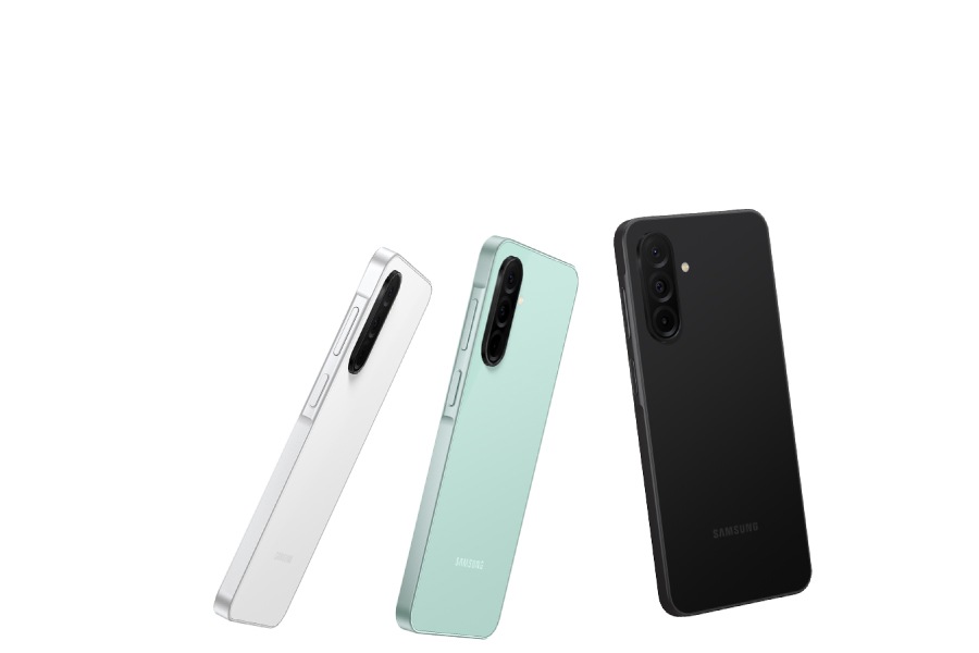 Four Galaxy A26 5G devices in White, Mint, Peach Pink and Black, showcasing their glass back featuring a 3-camera layout.