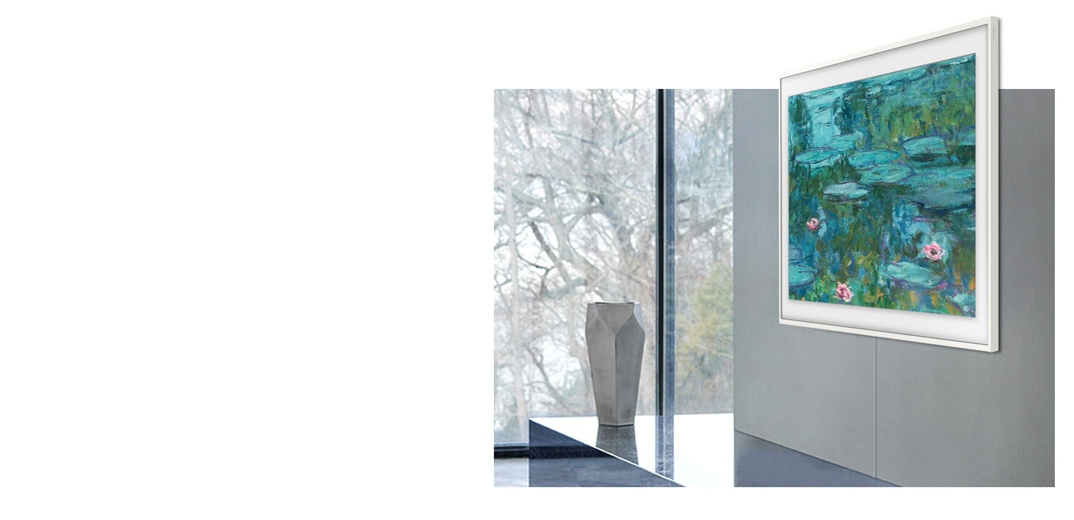 The TV hangs like a work of art on a wall in a stylish living space with a tapestry onscreen. It is next to a vase, which is on top of a marbled surface near a large floor-to-ceiling window.