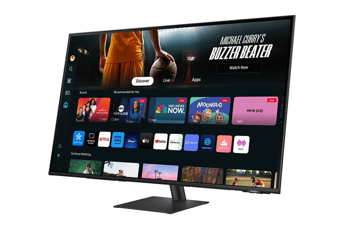 Front-right perspective of 43inch Samsung Smart Monitor M70D with Smart TV Apps on screen.
