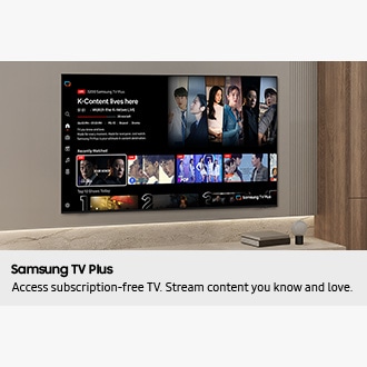 TV in a living room shows Samsung TV Plus home screen and the diverse TV channels available with it. 
