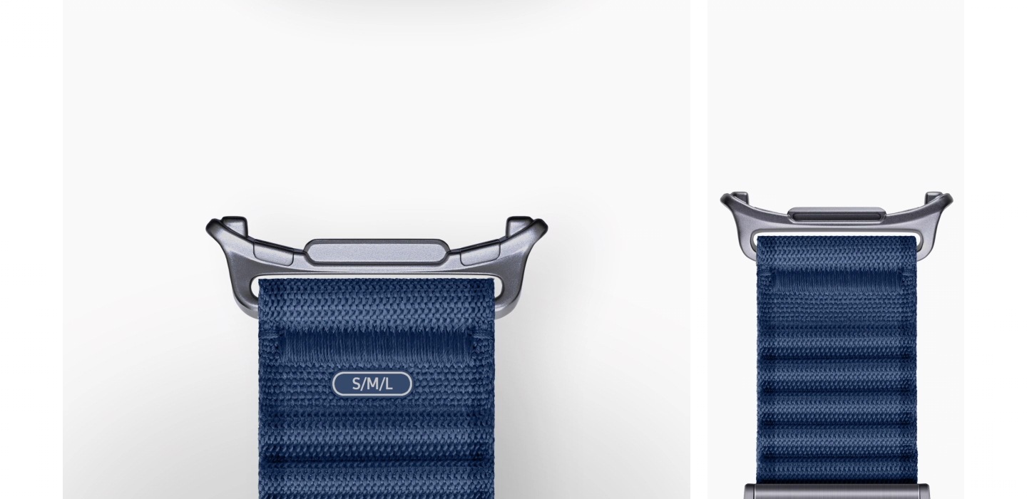 The bottom half of a Blue Galaxy Watch Ultra Trail Band appears on screen, followed by Galaxy Watch Ultra. The Dynamic Lug System on the inner lining of the Blue Galaxy Watch Ultra Trail Band easily attaches to the watch body of the Galaxy Watch Ultra. The shot zooms out, showing the back of the Galaxy Watch Ultra attached to the top and bottom portion of the Blue Galaxy Watch Ultra Trail Band.