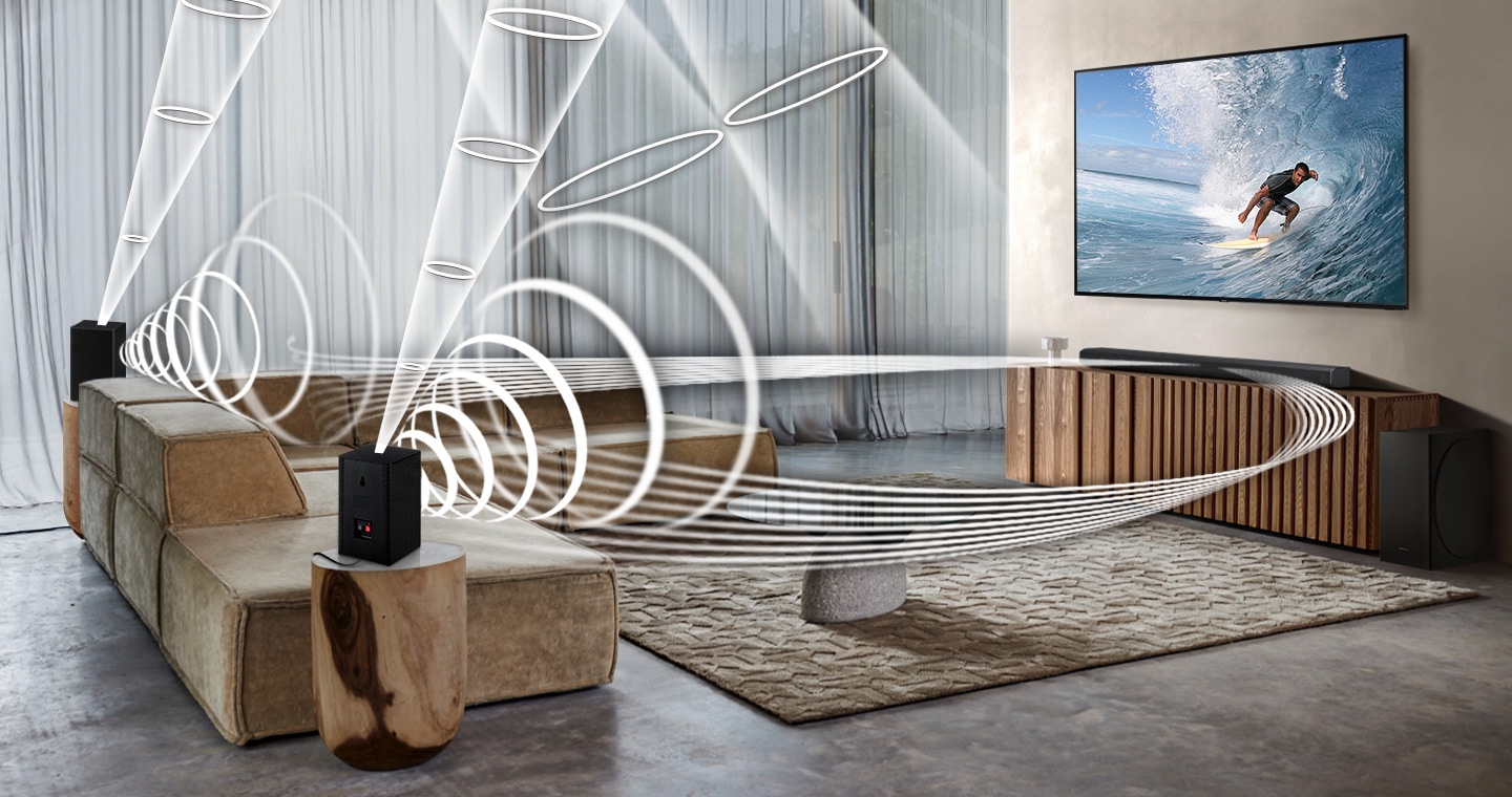 Soundwave graphics are playing from rear speakers and soundbar, demonstrating Wireless Dolby Atmos surround sound feature of Samsung Wireless Rear Speaker SWA-9500s.
