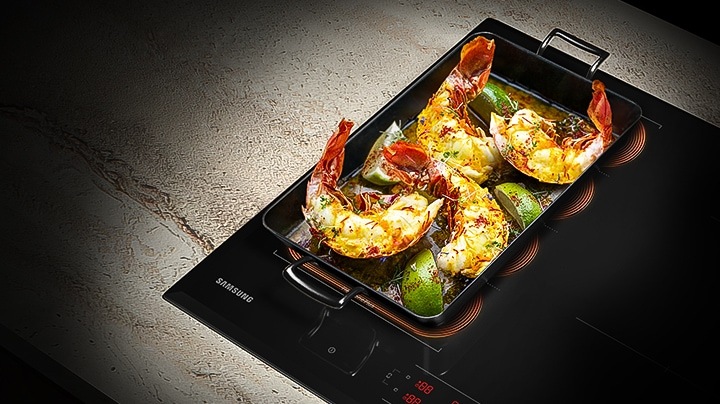 A rectangle pan with shrimps and limes is on the Flex Zone Plus.