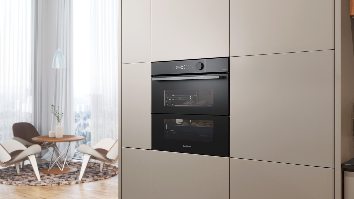 Shows the built-in oven installed in a kitchen, with two cooking zones and a hinged door, next to a Microwave Combi oven.