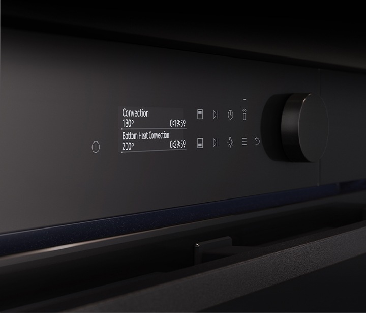Shows a close-up of the oven's stylishly minimalist control panel with an LCD display, which shows pictures of the various cooking options, touch control and a single knob.