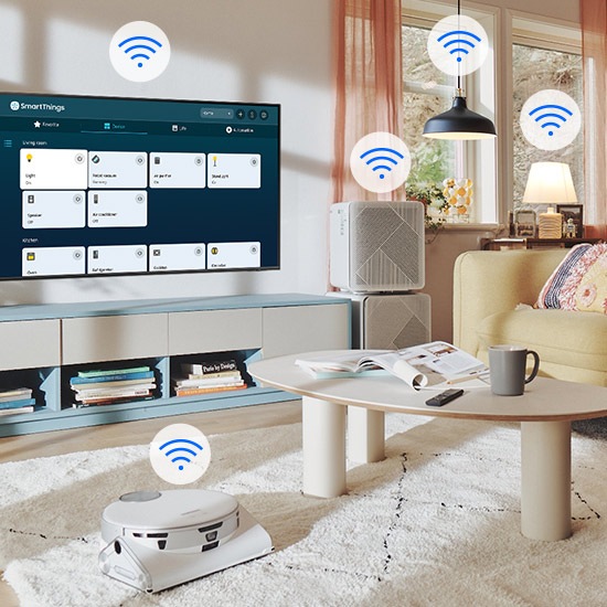 The SmartThings UI is on display on the TV. Wi-Fi icons are floating on top of the TV, vacuum robot, air purifie and lights