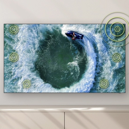 A person on a boat is making circular motion on the water. Built-in speakers follow the sound of the boat as it moves.