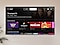 Samsung TV Plus UI image shows various images of popular content. 