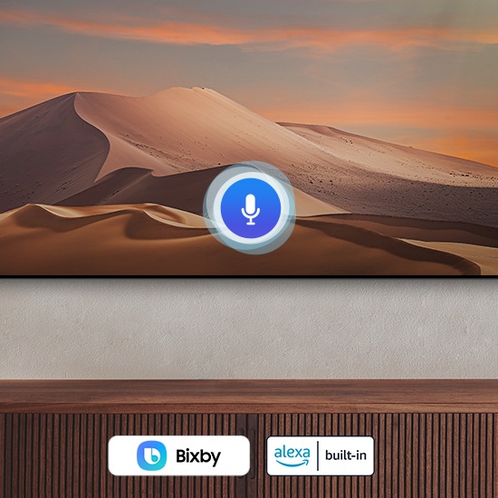 A TV is showing a voice microphone and bixby and alexa logos
