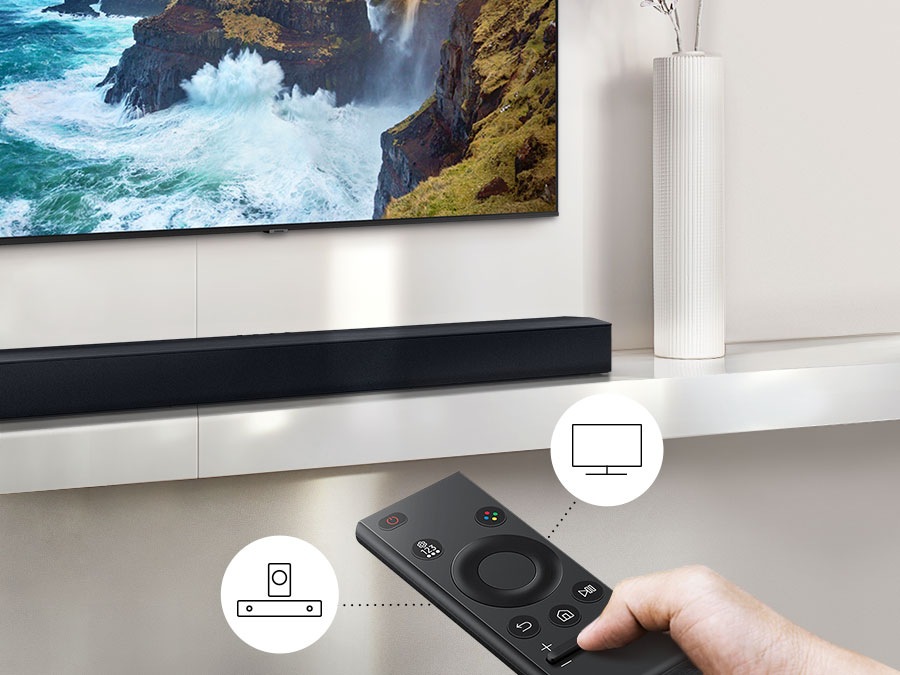 The user controls both Soundbar and TV functions with Samsung TV remote.