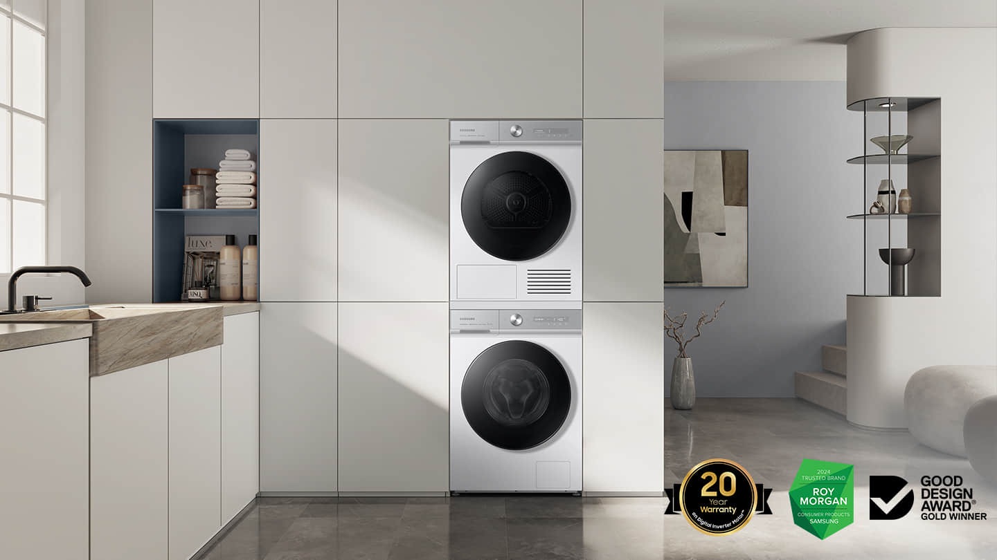Bespoke washer and dryer stacked together with pairing kit is installed in the laundry room.