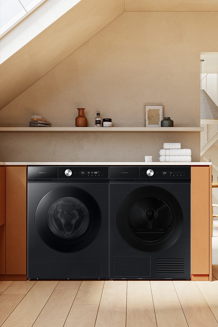 Bespoke Laundry stacked in a kitchen, black washer and dryer models