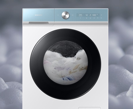 The clothes are in the drum with bubbles.