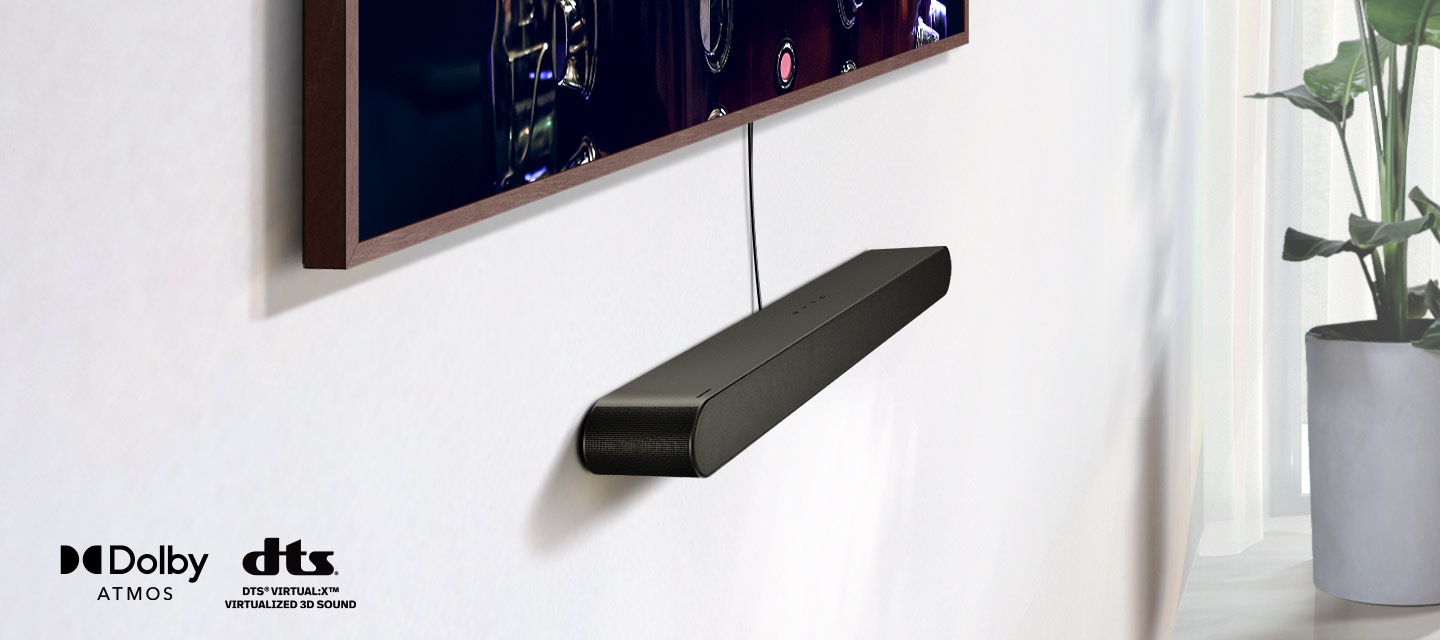 A close-up on a Samsung Soundbar installed underneath a TV, along with the logos for Dolby Atmos and DTS Virtual:X. A Wi-Fi signal icon pops up near the Soundbar. The scene zooms out to reveal an entire living room. The Soundbar gives off a series of round sound waves.