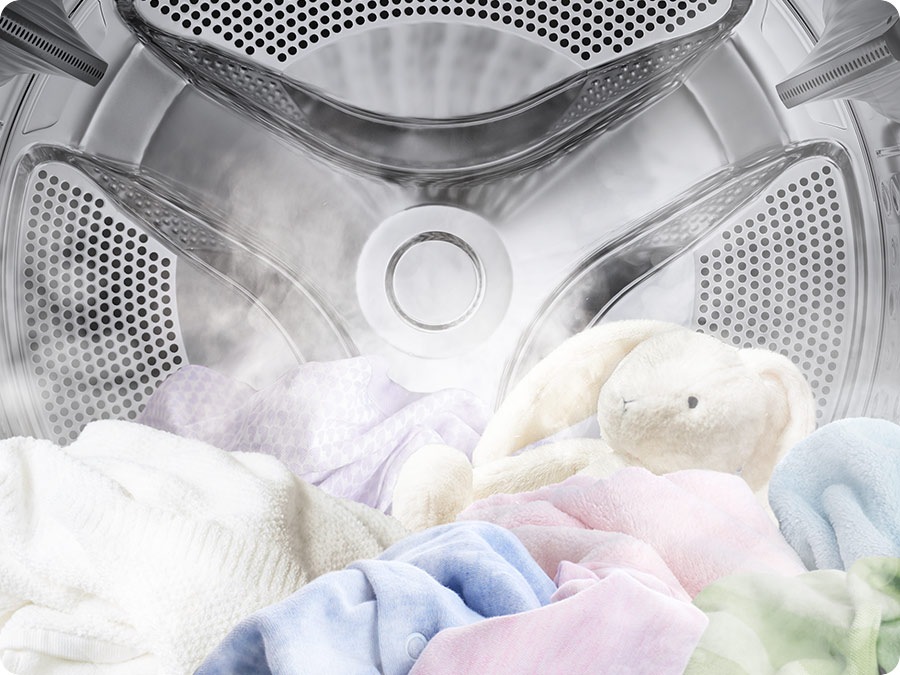 A close-up of towels, clothes, and a bunny doll in the Laundry Combo drum full of steam.