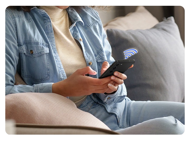 It shows a person touching a smartphone with a Wi-Fi icon displayed on top of it.