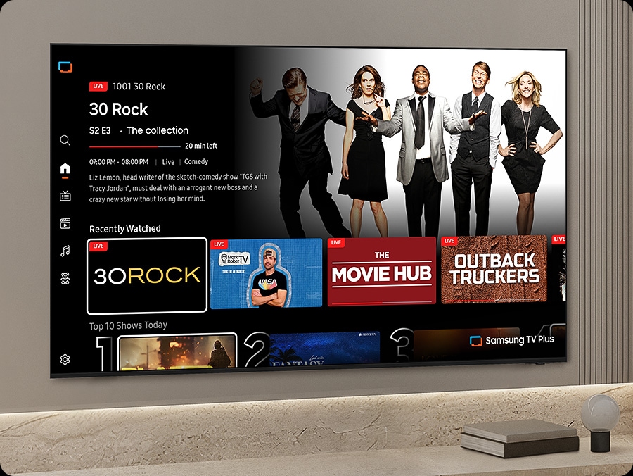 TV in a living room shows Samsung TV Plus home screen and the diverse TV channels available with it.