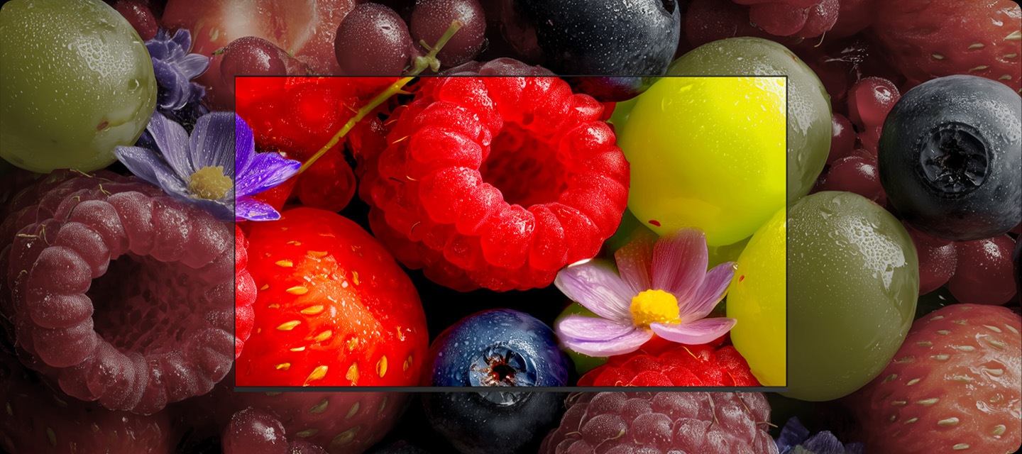 Dull close-up image of fruits and berries looks incredibly vibrant and colorful when displayed on a Real QLED TV.