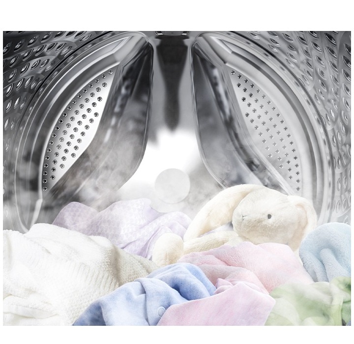 Image shows the inside of a machine washing with steam and clothes being cleaned