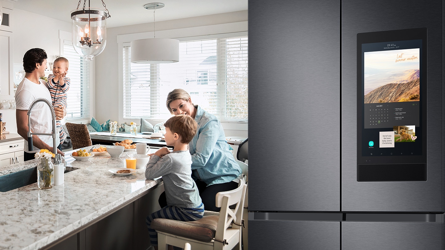 Parents with kids having breakfast on the kitchen bench with Samsung Family Hub™ featured on the right