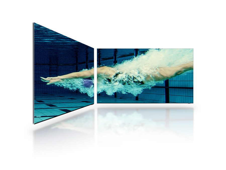 A woman diving into a pool shown across 2 TV screens