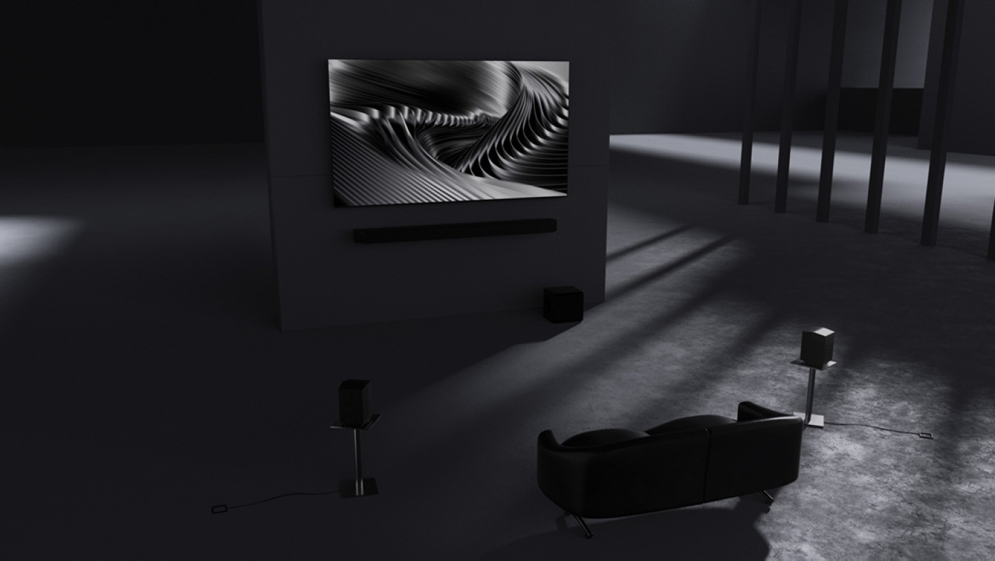 Close-up of Q-Series Soundbar Q930F. Zoom out to Q930F below TV in a room. Q930F inner components show how 9.1.4ch fully immersive surround sound is created. Immerse yourself in breathtaking sound. Subwoofer inner components are shown. 6.5-inch active unit with 8-inch passive radiator. Soundwaves play from subwoofer. Rear speaker inner components are shown and soundwaves show upfiring channels. Soundwaves in various directions show Wireless Dolby Atmos with Dolby Atmos logo. Cable between TV and soundbar disappears. Immersive sound without an HDMI cable. TV & Soundbar speakers work together in perfect harmony with Q-Symphony. SpaceFit Sound Pro analyzes the room for stunning sound automatically tuned and calibrated for your space. Active Voice Amplifier Pro boosts voices based on outside noise and in-content audio, so you can catch every word without distraction. Adaptive Sound plays sound and dialogue optimized for your content. Q930F setup with TV. Samsung logo.