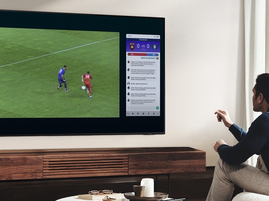 Man watching sport on a TV screen and a side menu