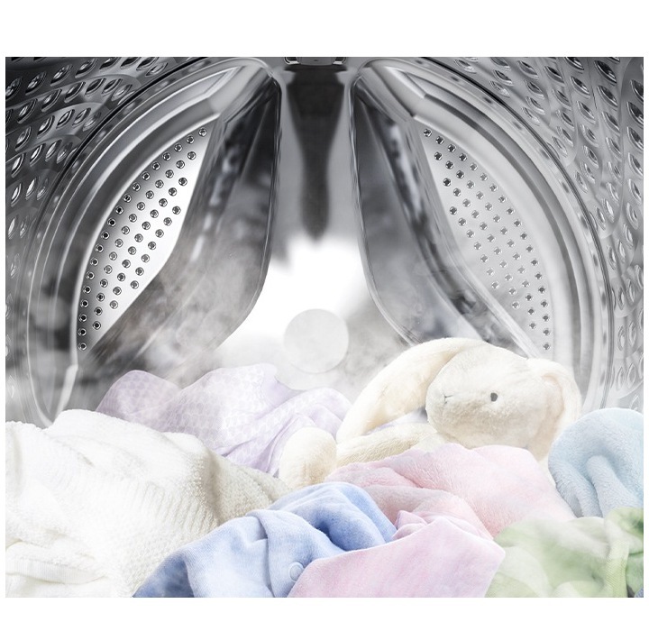 Image shows the inside of a machine washing with steam and clothes being cleaned