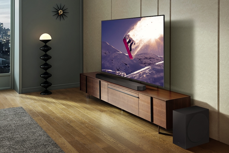 Samsung Soundbar Q800C, subwoofer and a TV in a living room.*