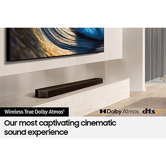 Samsung Soundbar connected wirelessly to TV. Dolby Atmos logo and DTS:X logo.